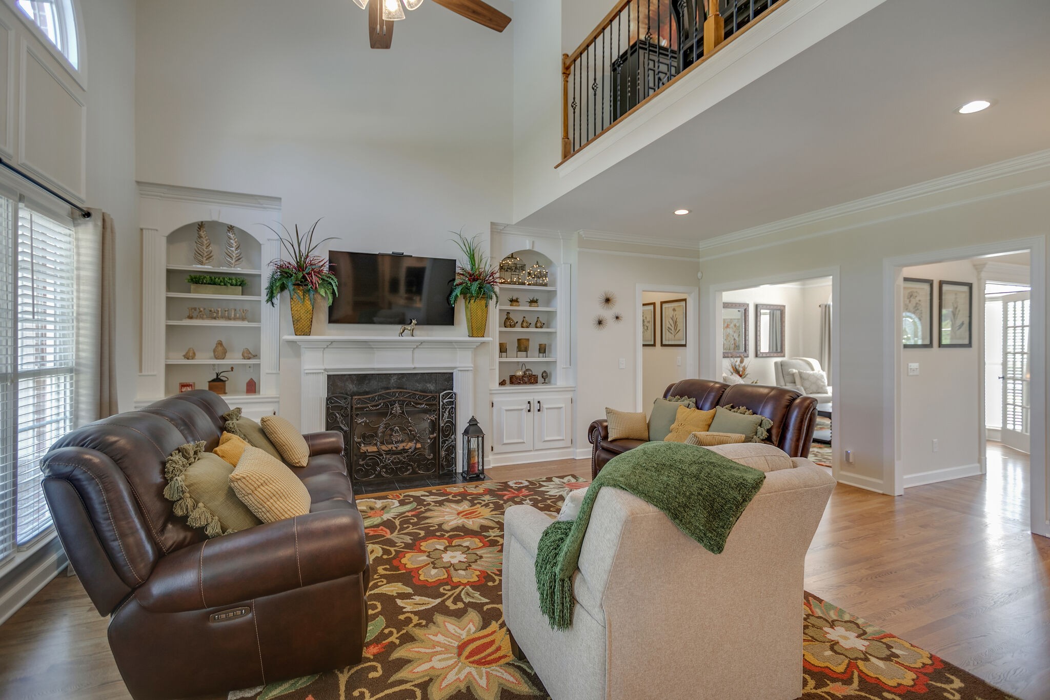 2260 Avery Court Franklin, TN 37067 - Photo 17 of 61 a living room with furniture a fireplace and a flat screen tv
