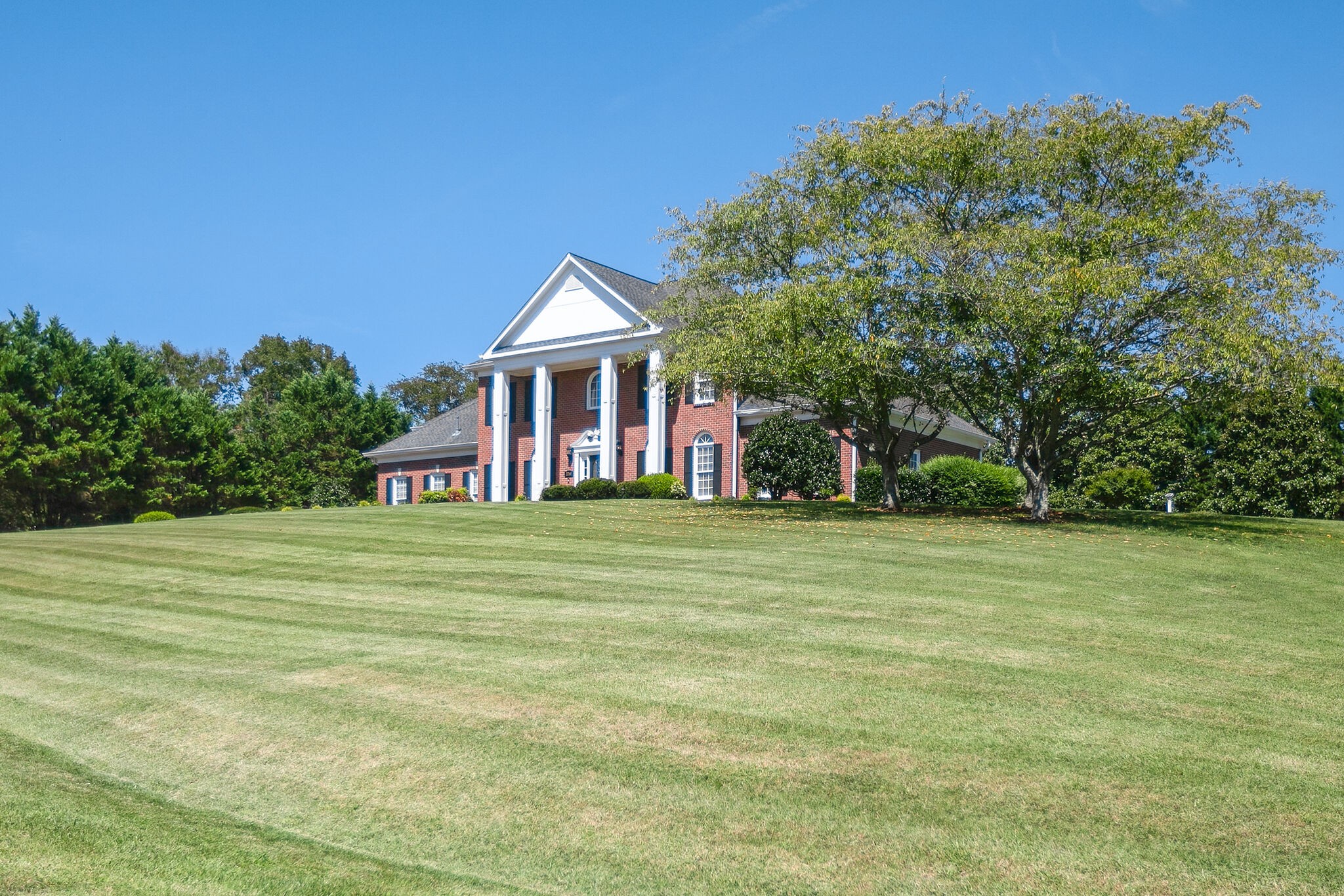 2260 Avery Court Franklin, TN 37067 - Photo 2 of 61 a front view of a house with a garden
