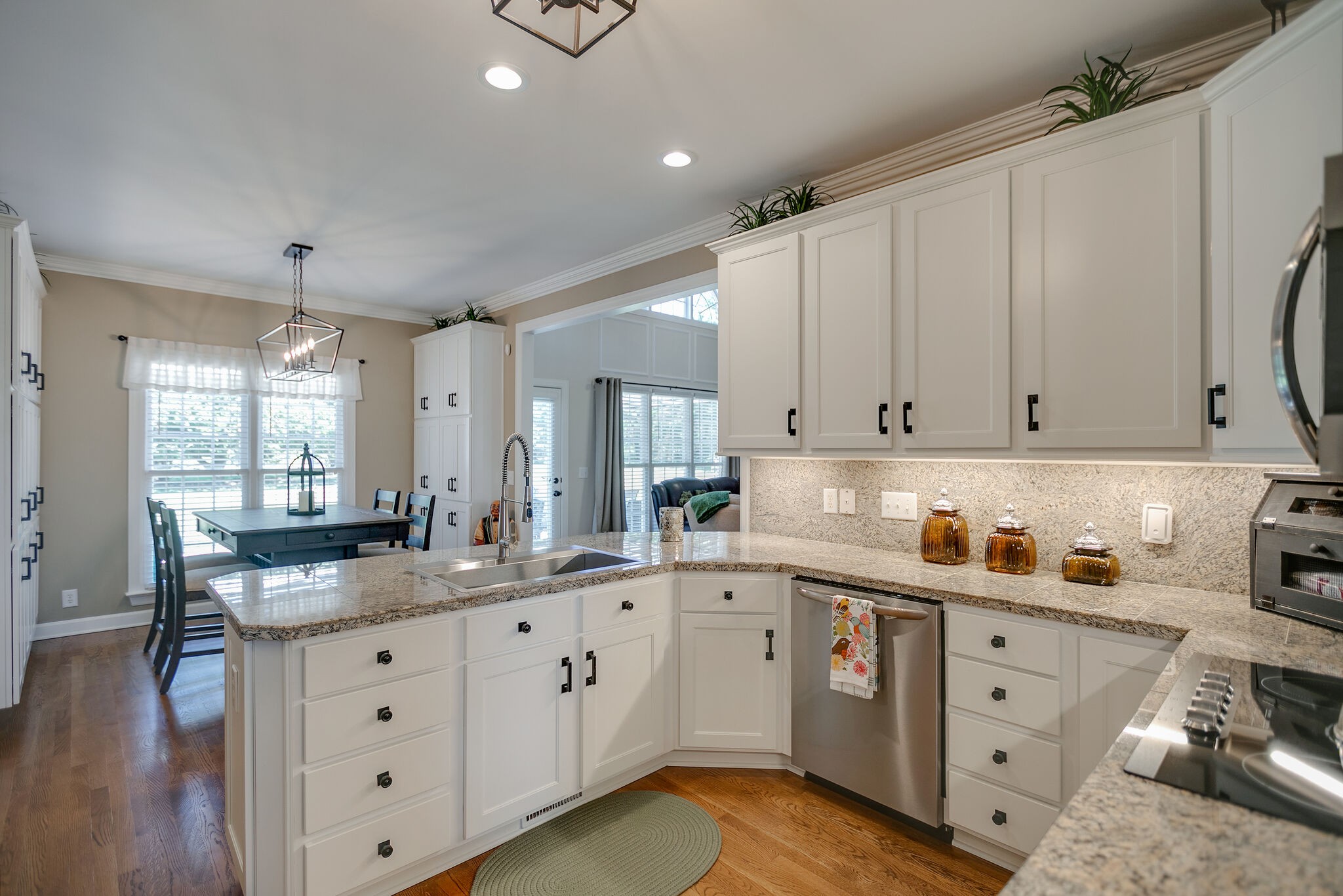 2260 Avery Court Franklin, TN 37067 - Photo 23 of 61 a kitchen with cabinets stainless steel appliances a sink and wooden floor
