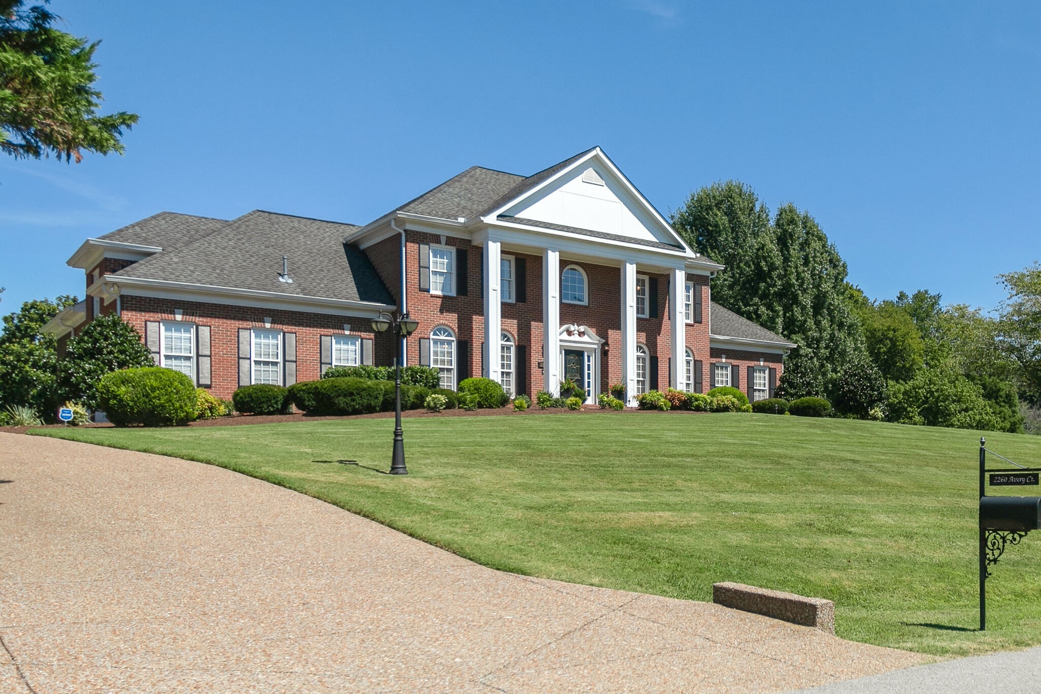 2260 Avery Court Franklin, TN 37067 - Photo 3 of 61 a front view of a house with a yard