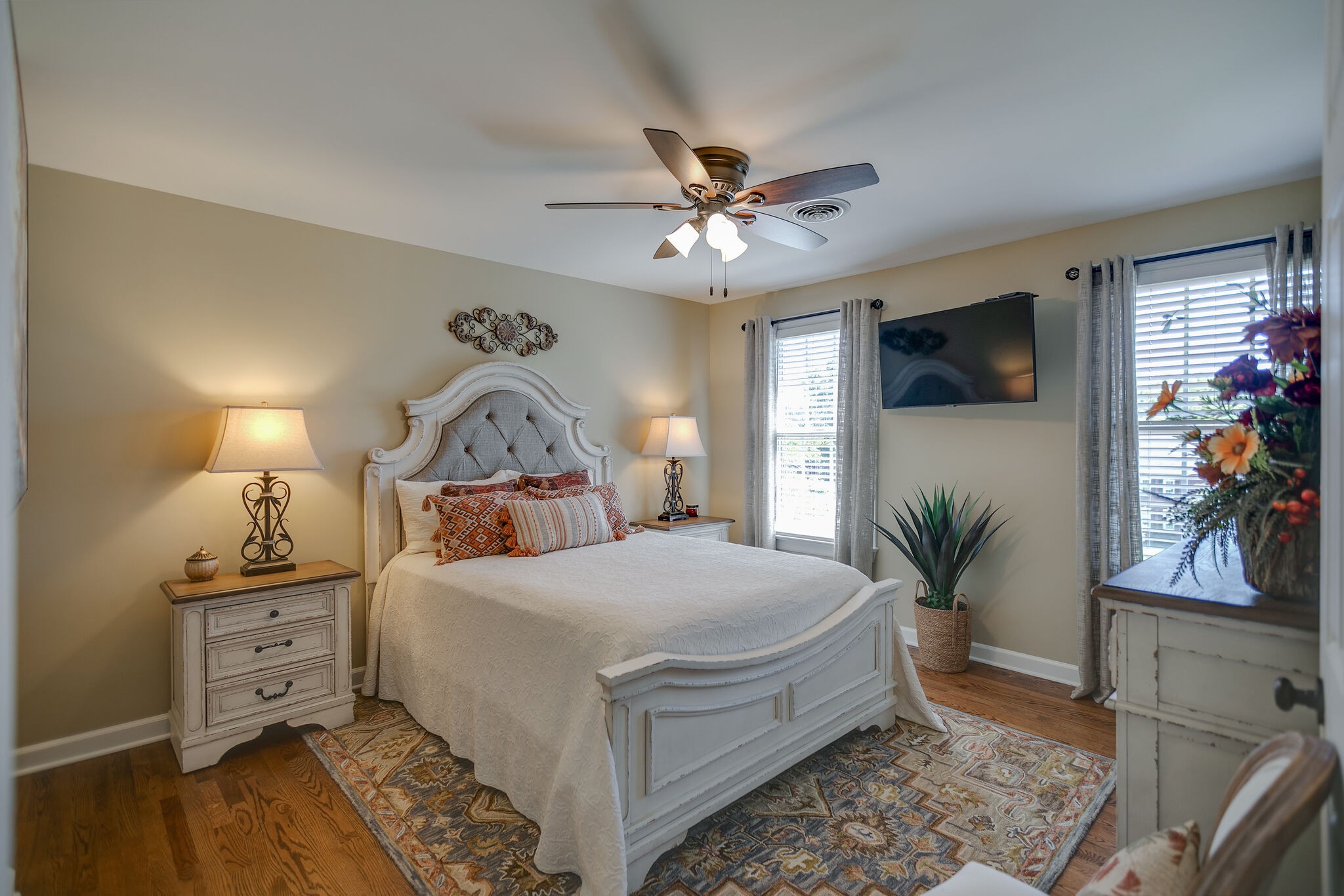 2260 Avery Court Franklin, TN 37067 - Photo 38 of 61 a bedroom with a bed a flat screen tv and a potted plant