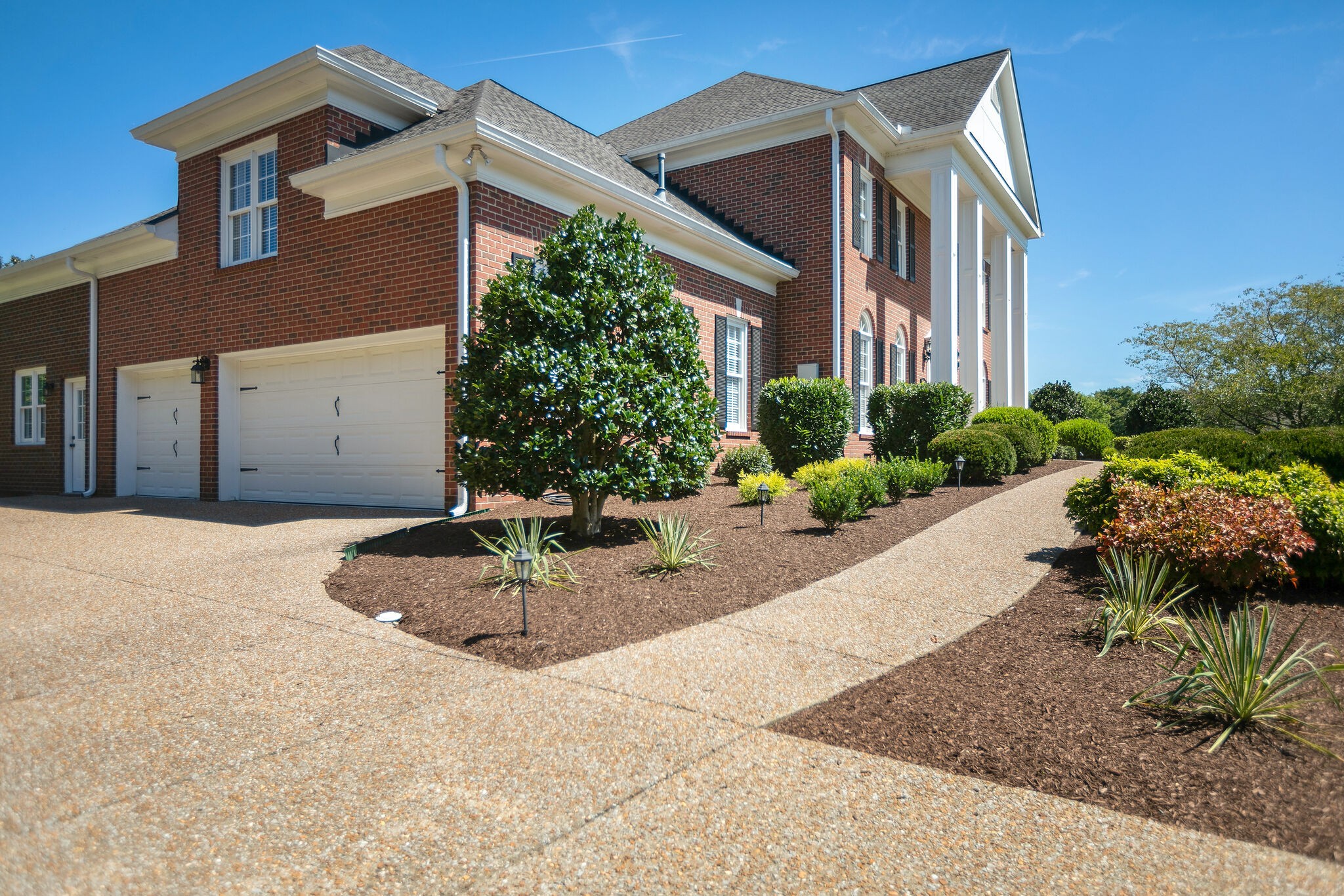 2260 Avery Court Franklin, TN 37067 - Photo 4 of 61 a front view of a house with a yard
