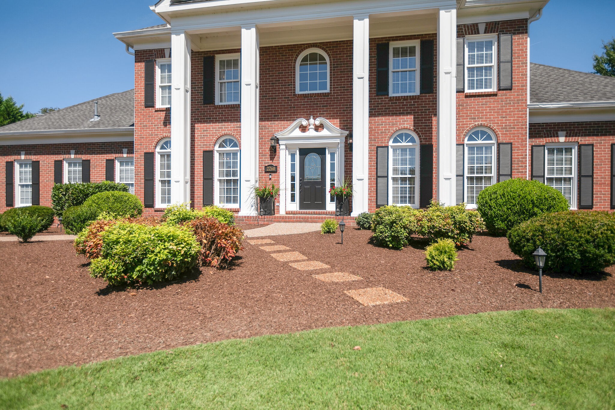 2260 Avery Court Franklin, TN 37067 - Photo 6 of 61 a front view of a house with a yard