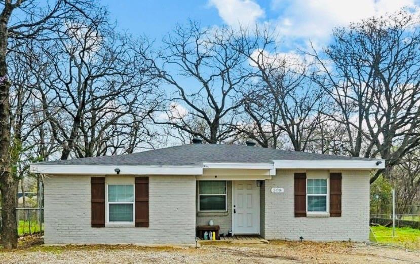 a house with trees in front of it