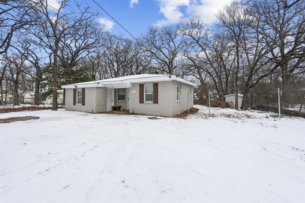 508 North Dick Price Road Kennedale, TX 76060 - Photo 1 of 34 a view of a house with a snow in the yard