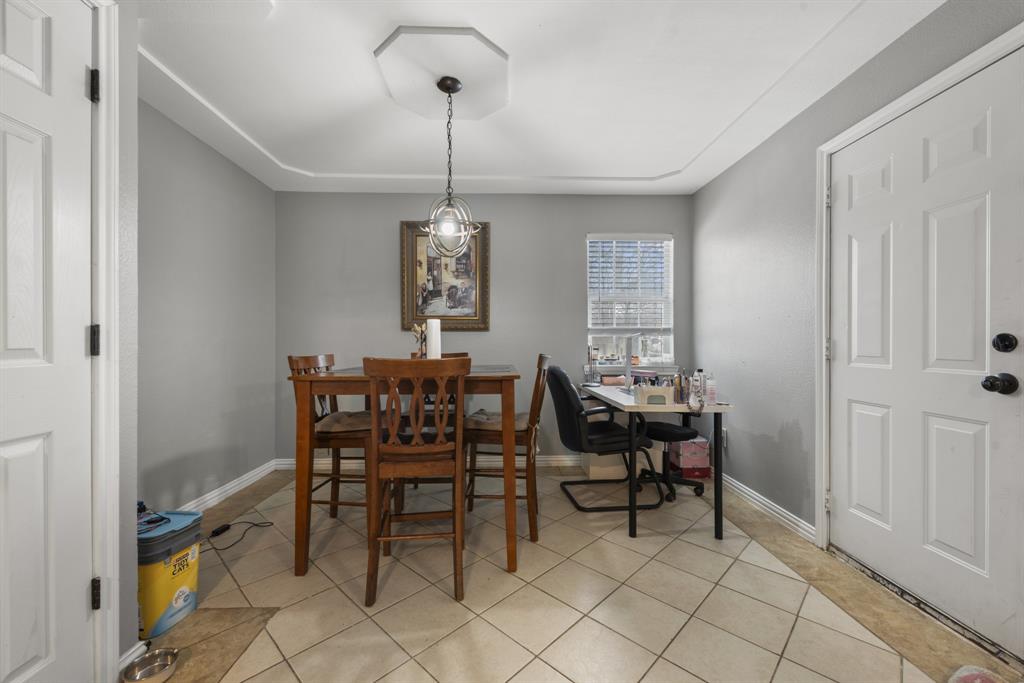 508 North Dick Price Road Kennedale, TX 76060 - Photo 15 of 34 a view of a dining room with furniture and chandelier