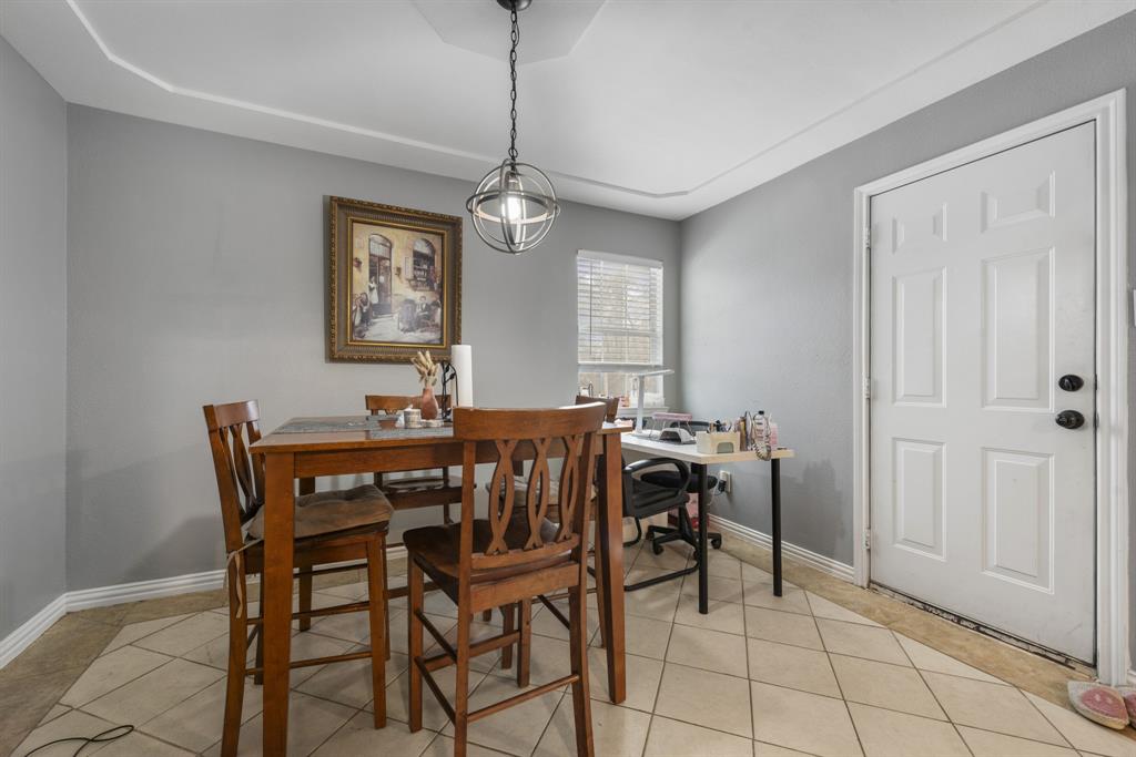 508 North Dick Price Road Kennedale, TX 76060 - Photo 16 of 34 a view of a dining room with furniture and chandelier