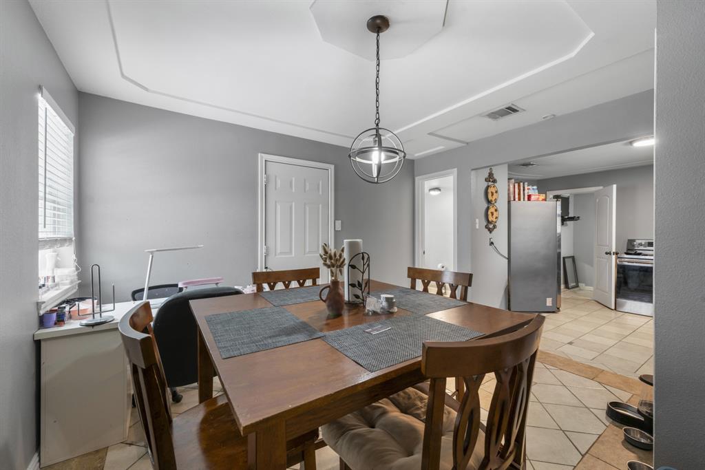 508 North Dick Price Road Kennedale, TX 76060 - Photo 17 of 34 a view of a dining room and a table and chairs in a room
