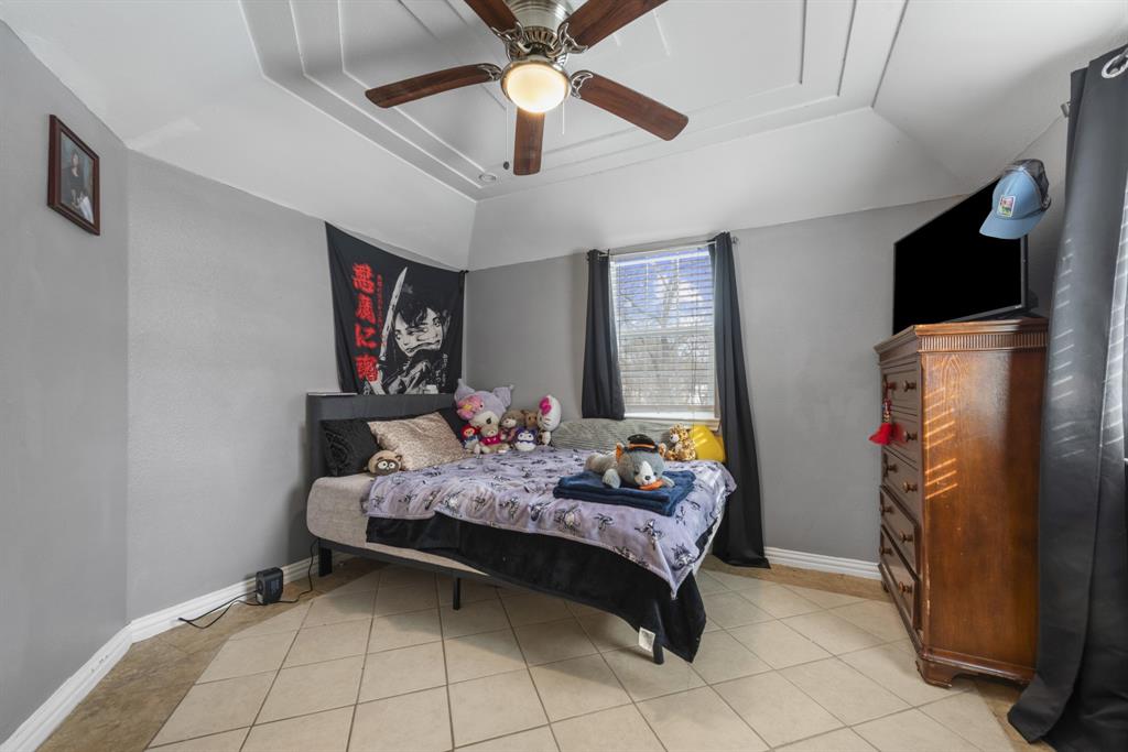 508 North Dick Price Road Kennedale, TX 76060 - Photo 22 of 34 a bedroom with bed and window