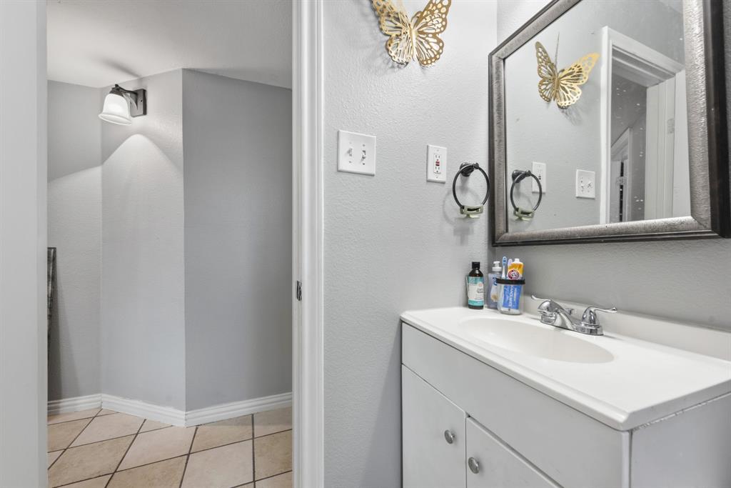 508 North Dick Price Road Kennedale, TX 76060 - Photo 30 of 34 a bathroom with a sink and a mirror