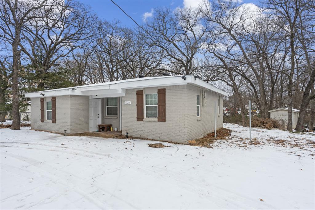 508 North Dick Price Road Kennedale, TX 76060 - Photo 3 of 34 a view of a house with a snow in the yard