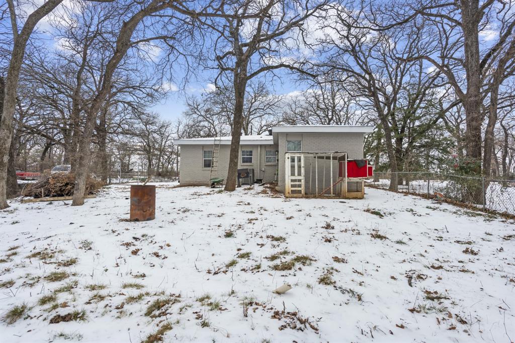 508 North Dick Price Road Kennedale, TX 76060 - Photo 31 of 34 a view of a house with a snow in the yard