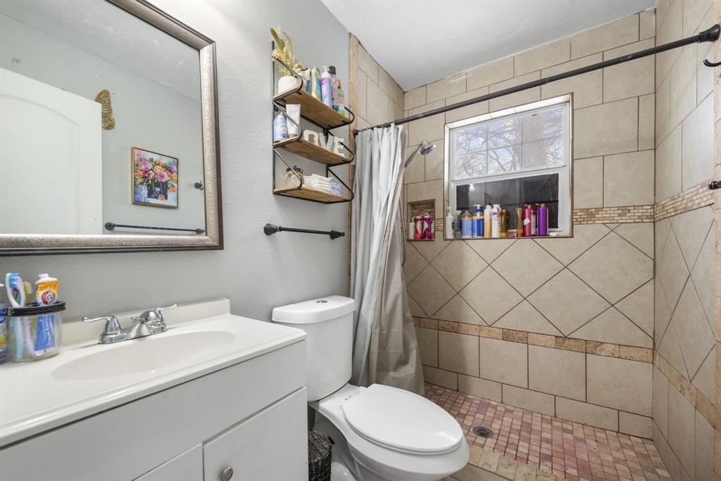 508 North Dick Price Road Kennedale, TX 76060 - Photo 6 of 9 a bathroom with a sink a toilet and shower