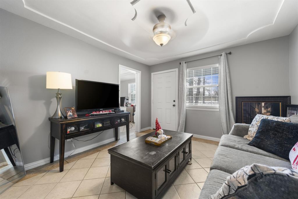 508 North Dick Price Road Kennedale, TX 76060 - Photo 8 of 34 a living room with furniture and a flat screen tv