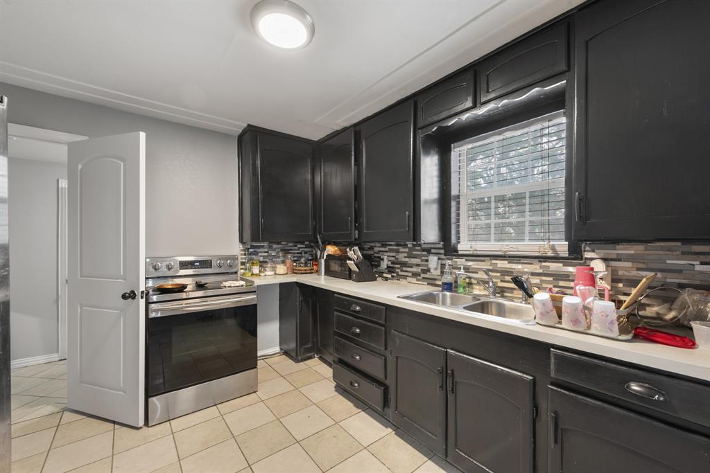 508 North Dick Price Road Kennedale, TX 76060 - Photo 10 of 34 a kitchen with a sink and cabinets
