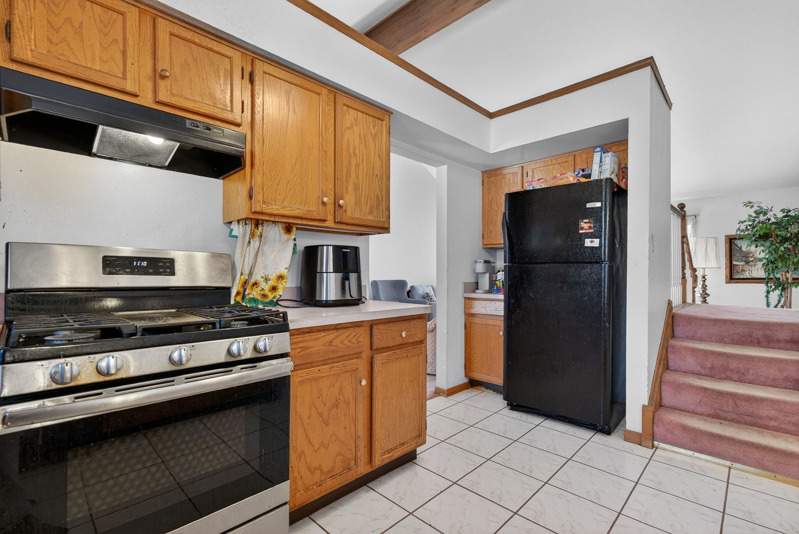 4448 Maple Avenue Matteson, IL 60443 - Photo 12 of 26 a kitchen with stainless steel appliances granite countertop a refrigerator and a stove