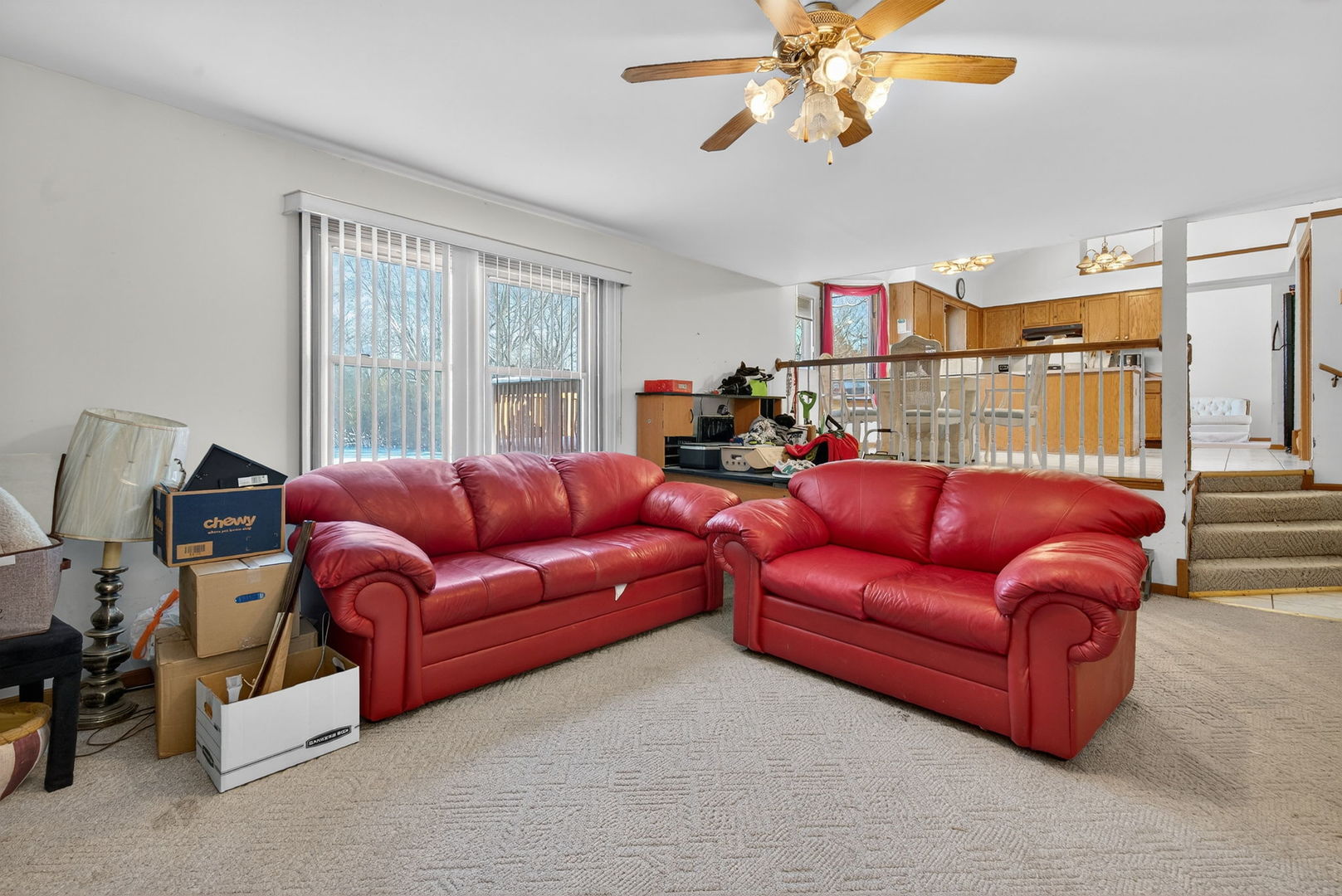 4448 Maple Avenue Matteson, IL 60443 - Photo 16 of 26 a living room with furniture a ceiling fan and a window