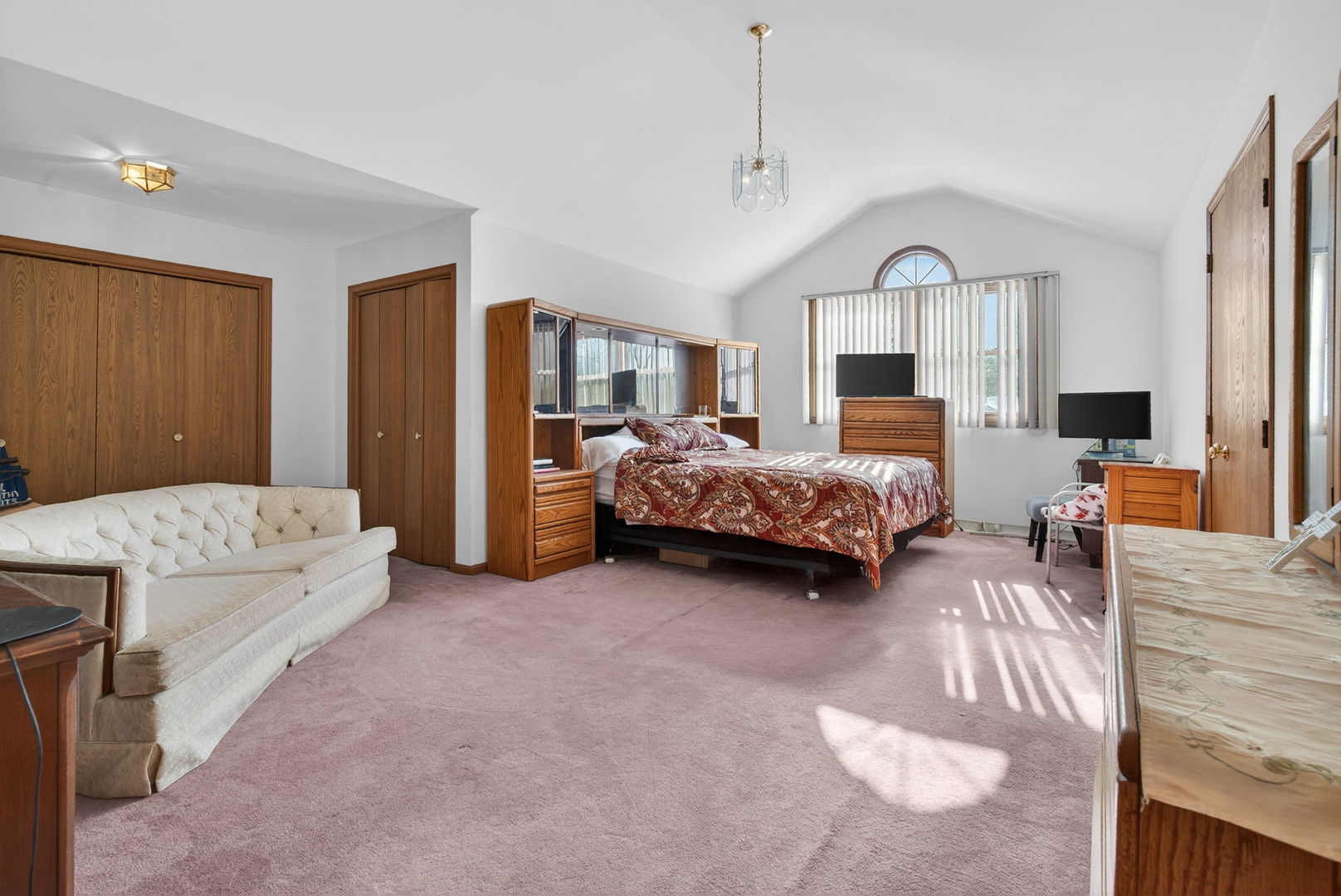 4448 Maple Avenue Matteson, IL 60443 - Photo 17 of 26 a spacious bedroom with a bed couch and a dresser