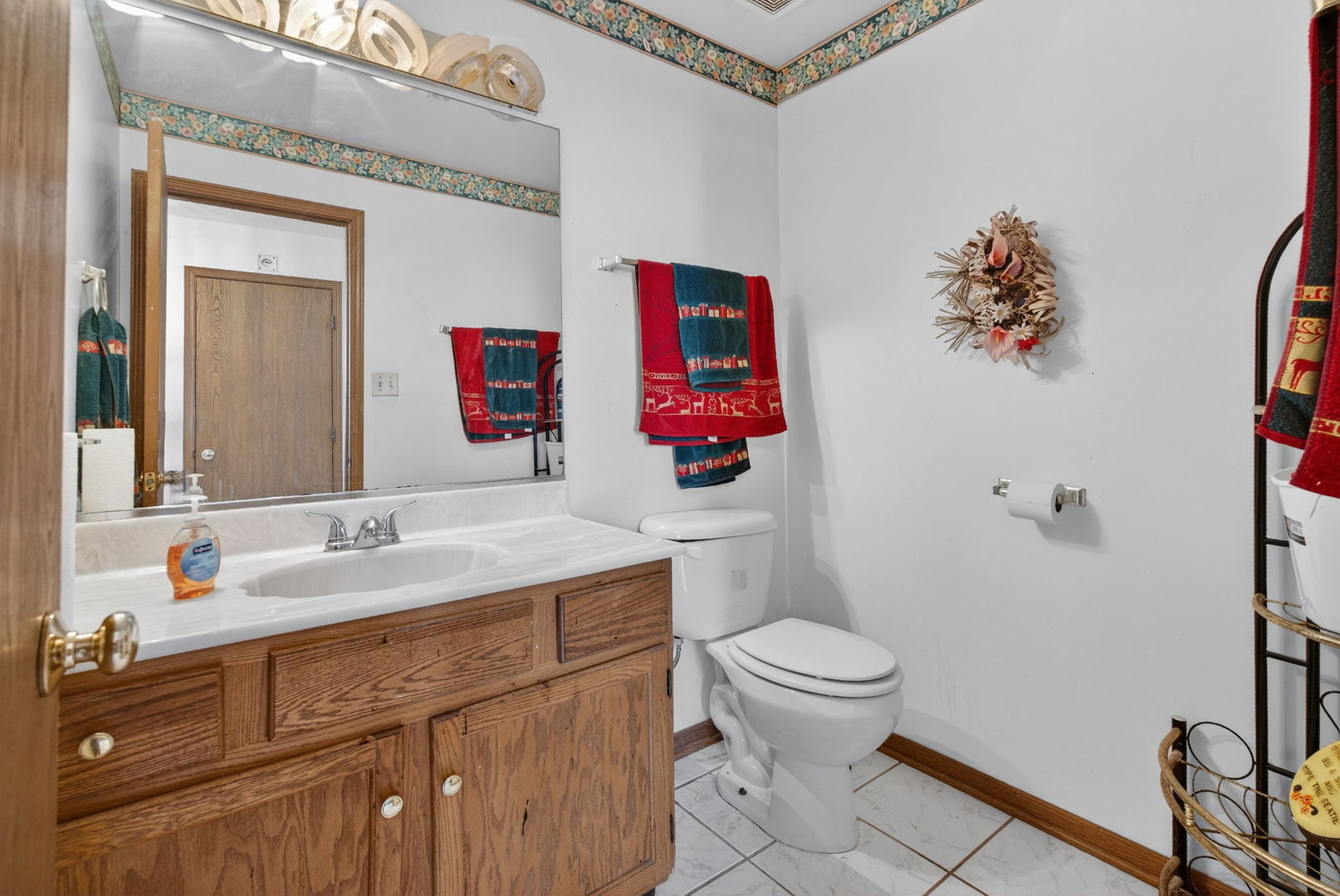 4448 Maple Avenue Matteson, IL 60443 - Photo 4 of 26 a bathroom with a sink vanity mirror and toilet