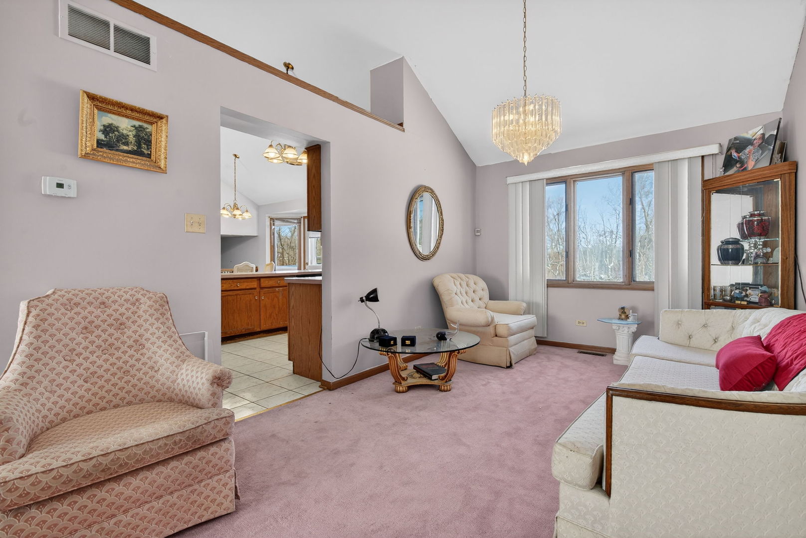 4448 Maple Avenue Matteson, IL 60443 - Photo 8 of 26 a living room with furniture a window and a chandelier