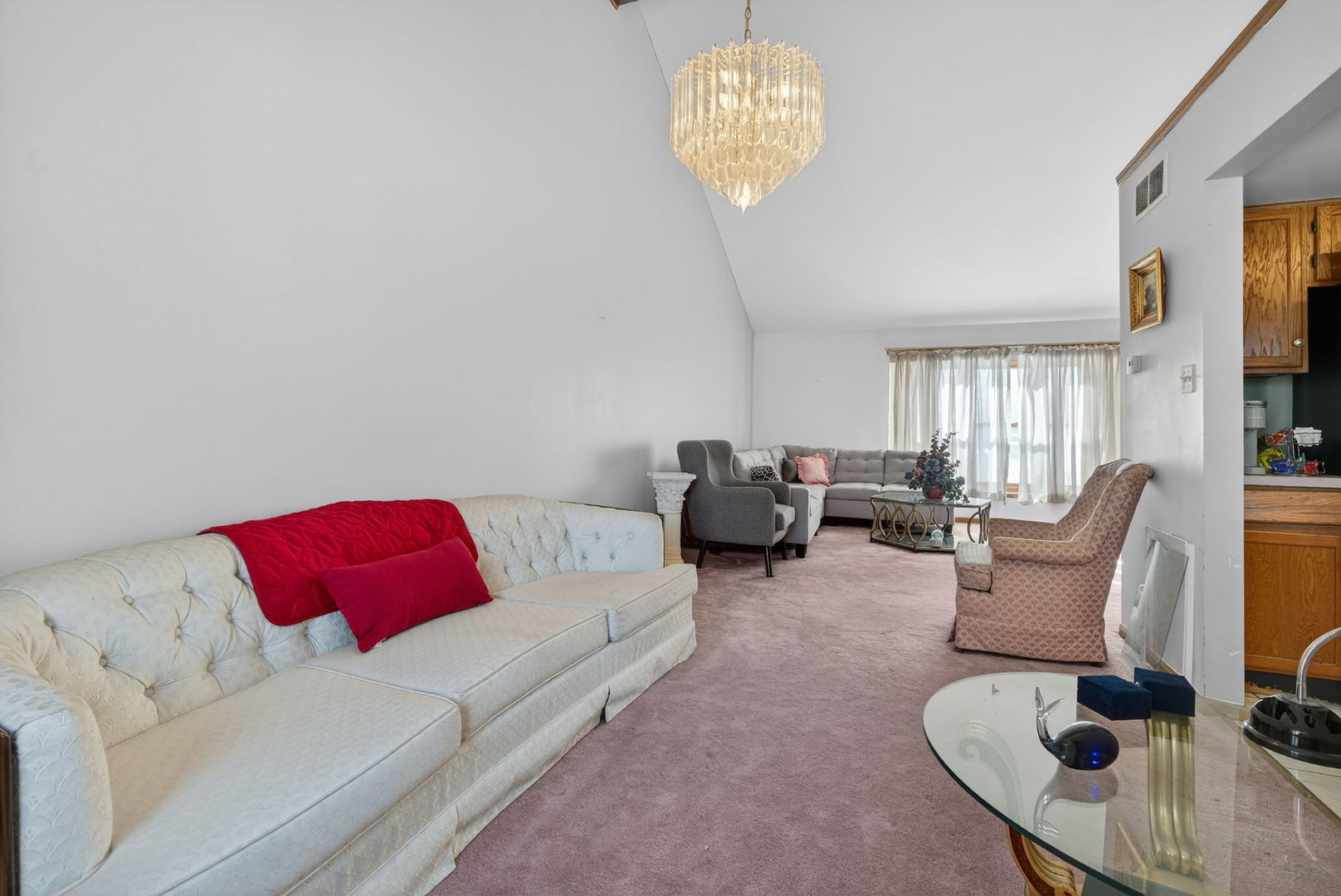 4448 Maple Avenue Matteson, IL 60443 - Photo 9 of 26 a living room with furniture a couch and a chandelier