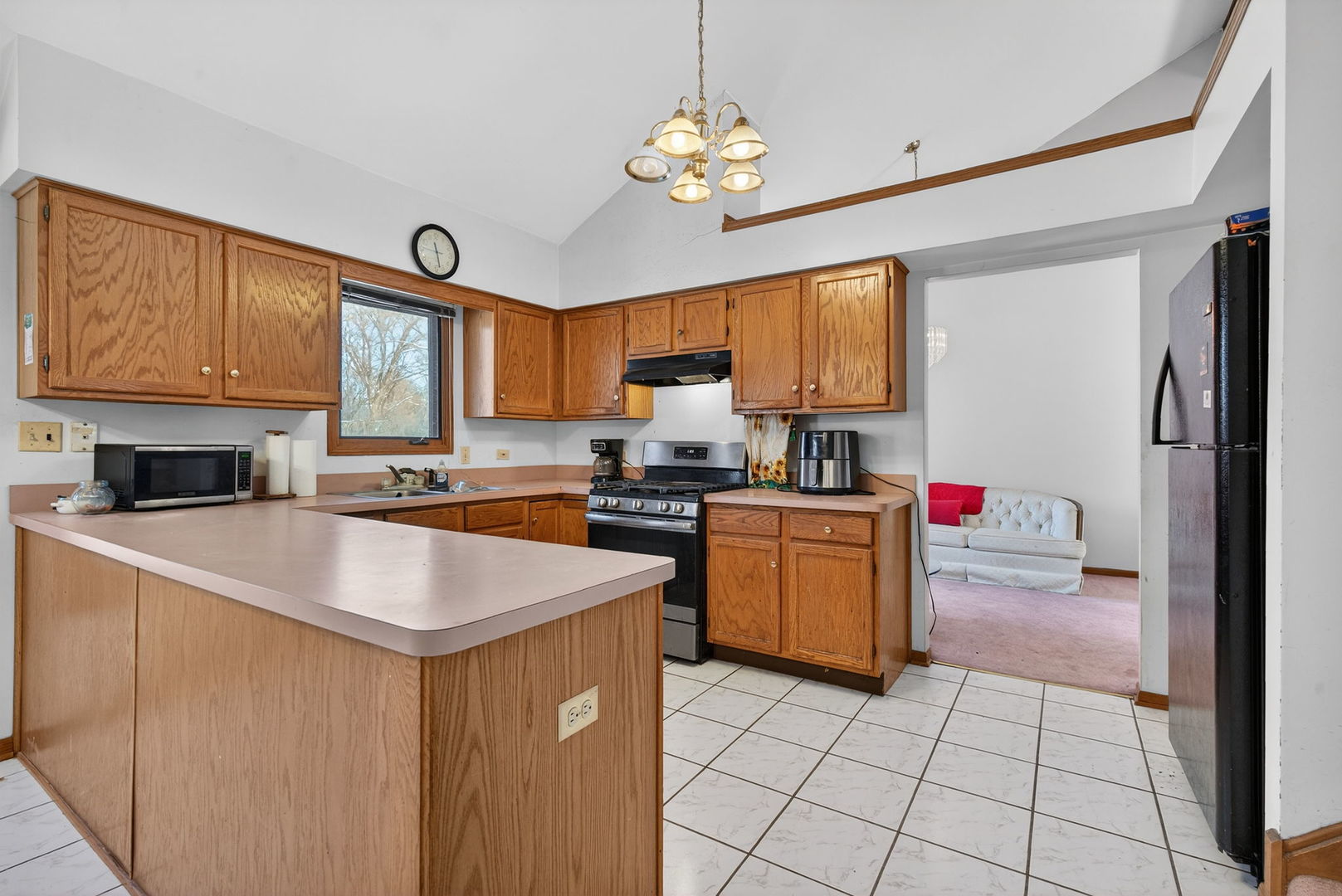 4448 Maple Avenue Matteson, IL 60443 - Photo 10 of 26 a kitchen with a refrigerator a sink a stove a microwave and island