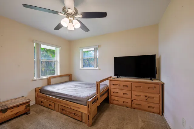 a living room with furniture and flat screen tv