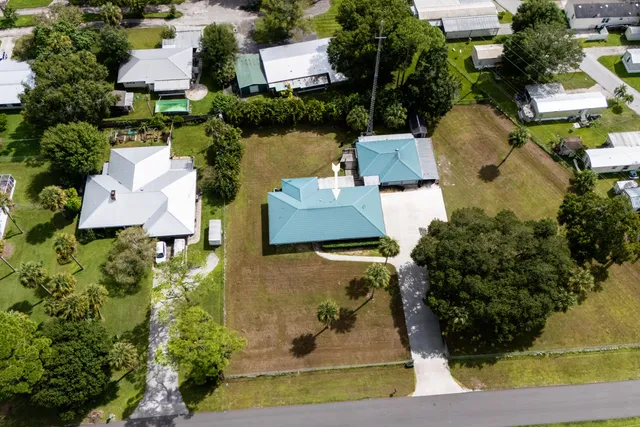 an aerial view of a house with outdoor space