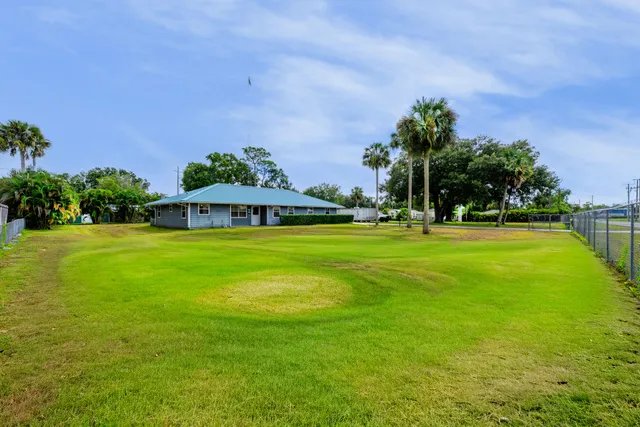 a view of a house with a big yard