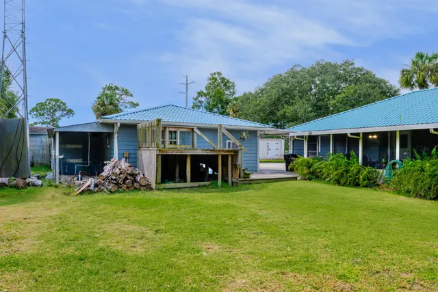 a front view of a house with garden and porch