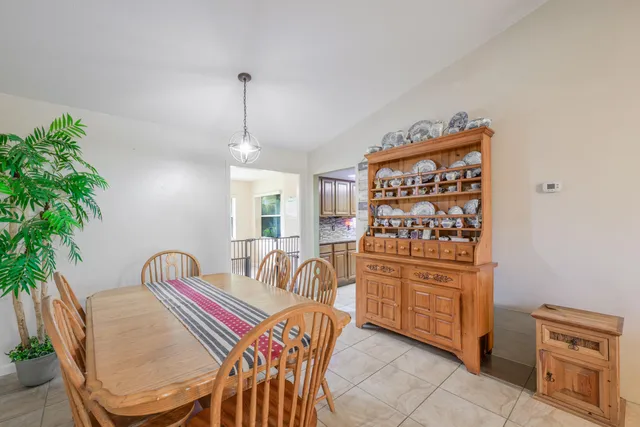 a bedroom with furniture and a potted plant