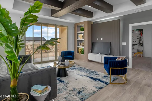 a living room with furniture and a potted plant