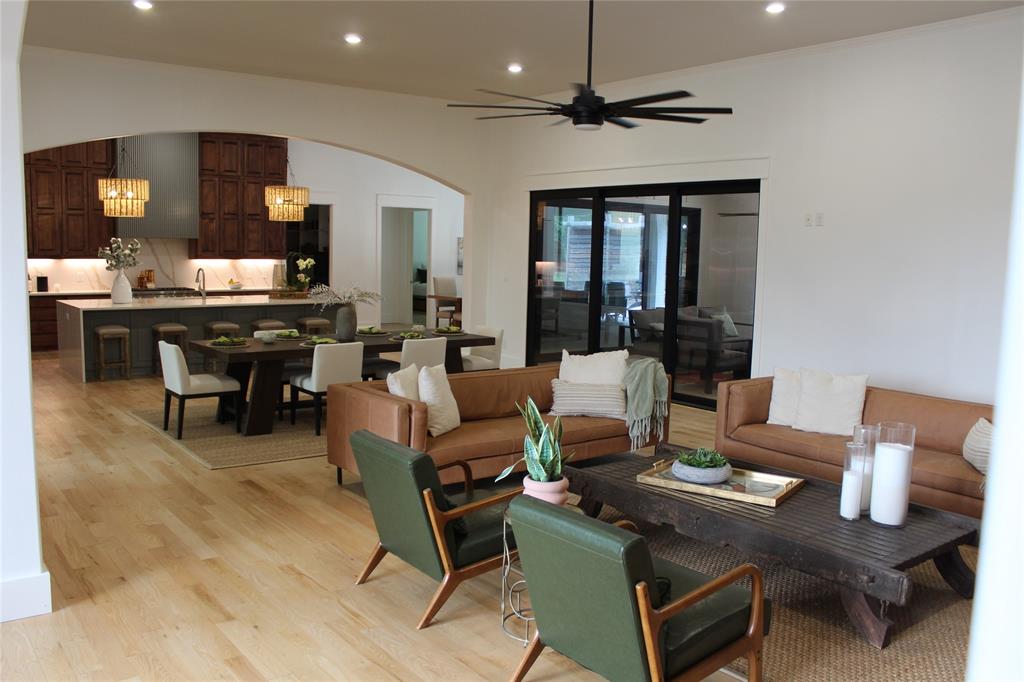 333 Renaissance Lane Heath, TX 75032 - Photo 15 of 35 Open-concept living area with wood-finish flooring, recessed lighting, and a contemporary ceiling fan