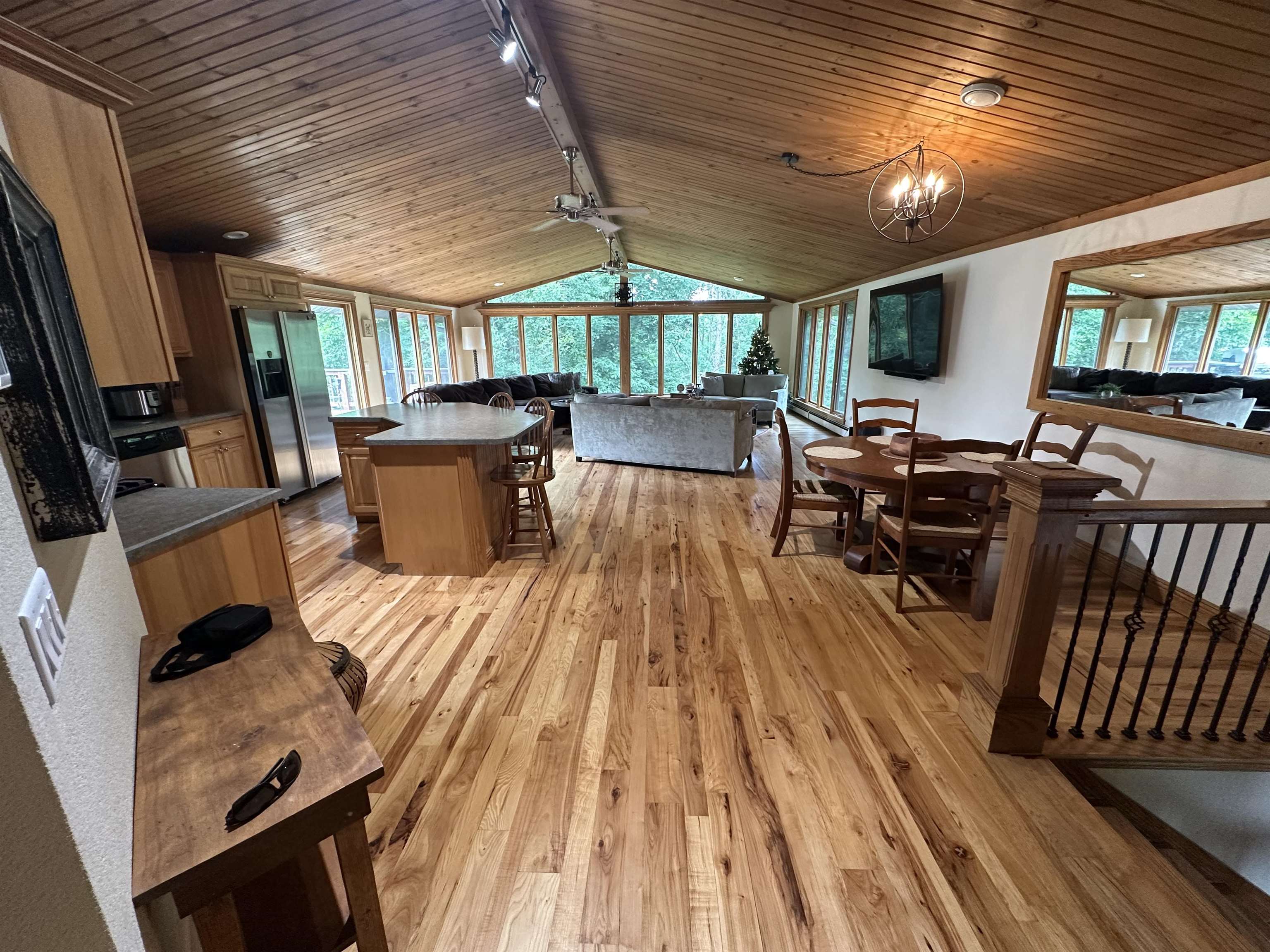 12750 West Cross Road Galena, IL 61036 - Photo 4 of 15 a view of a patio with dining table and chairs with wooden floor and fence