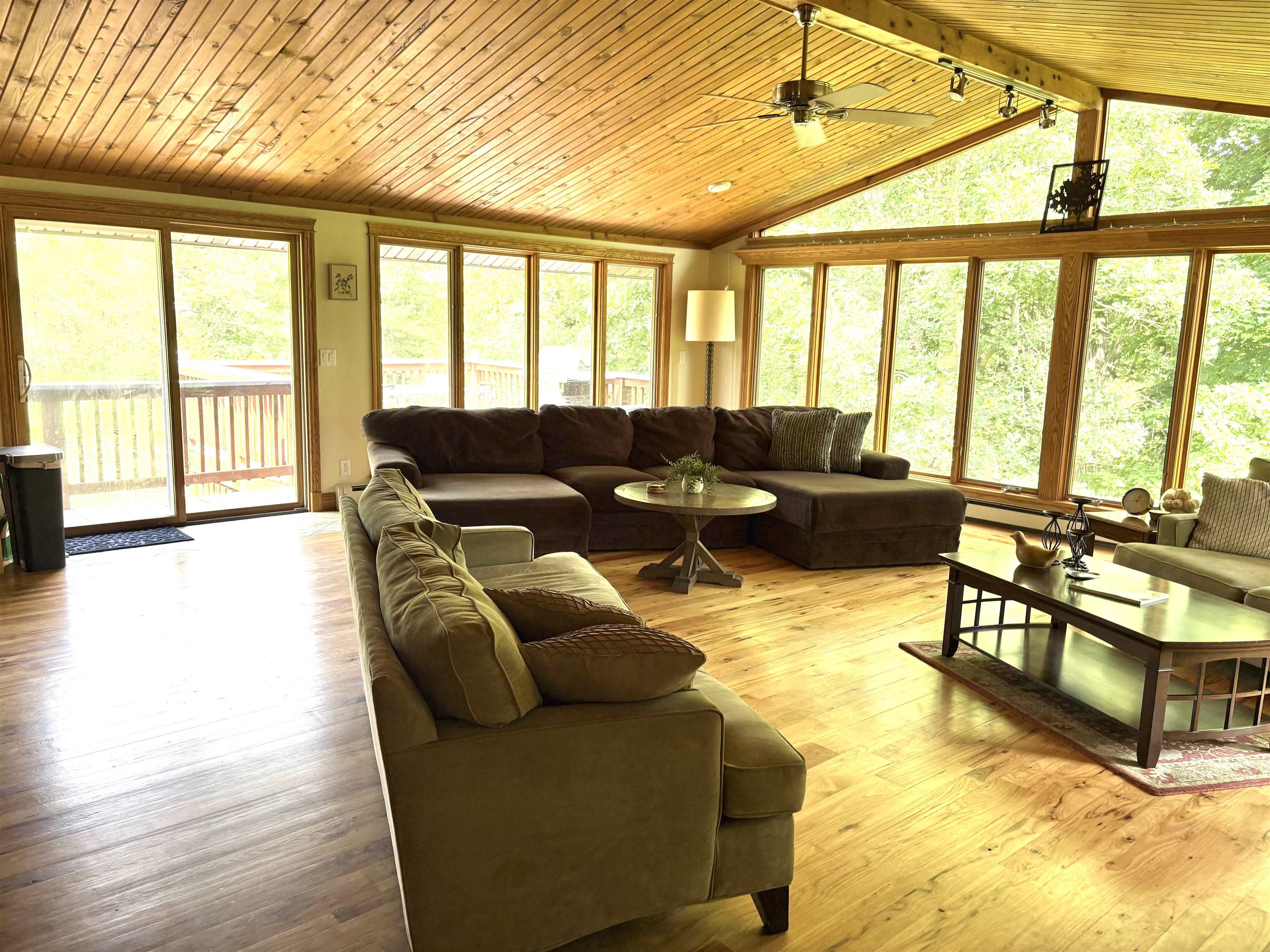 12750 West Cross Road Galena, IL 61036 - Photo 7 of 15 a living room with furniture and floor to ceiling windows