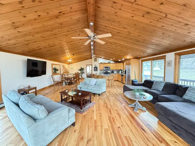 a living room with furniture and flat screen tv