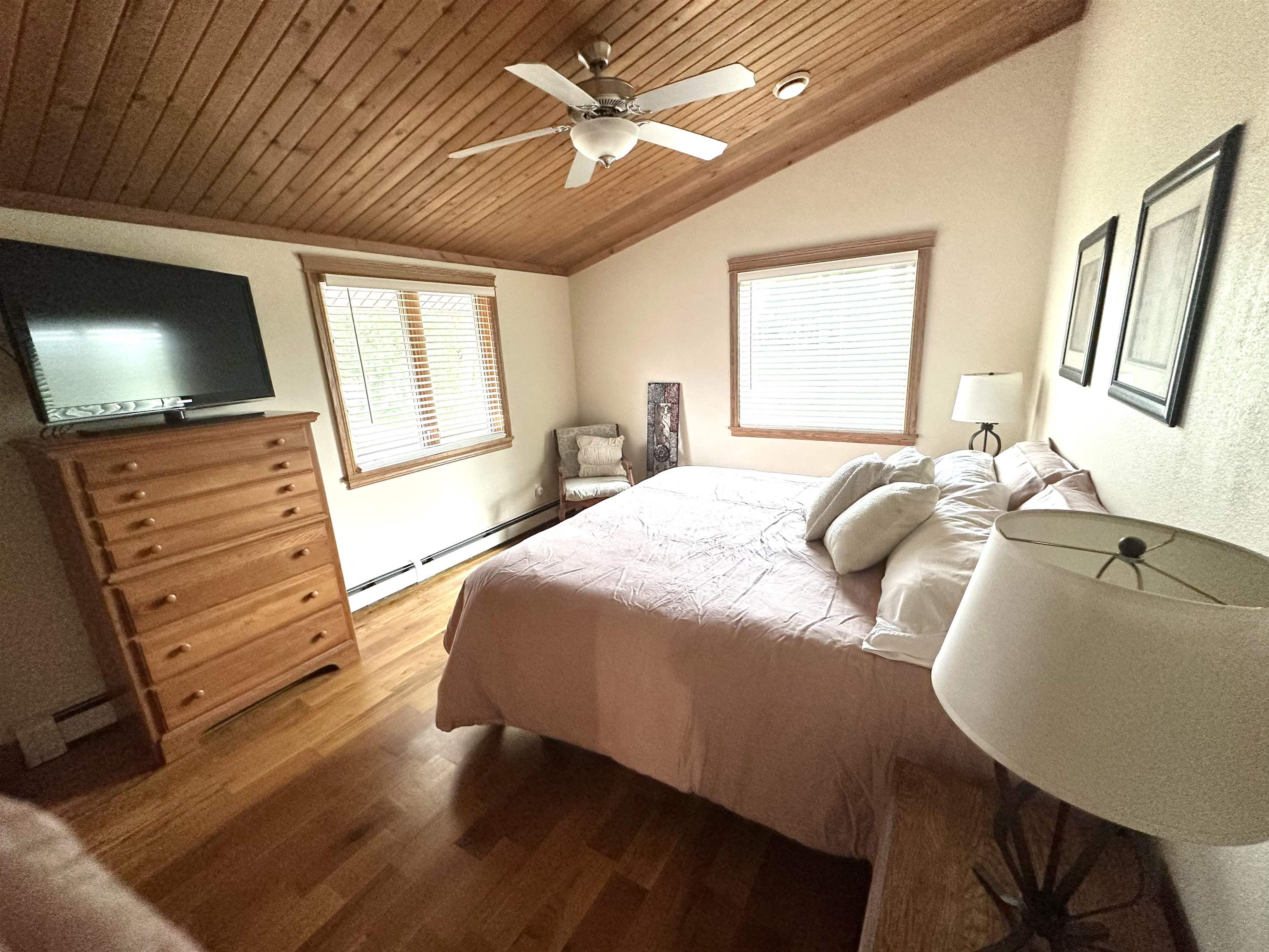 12750 West Cross Road Galena, IL 61036 - Photo 9 of 15 a bedroom with a bed a flat screen tv and dresser