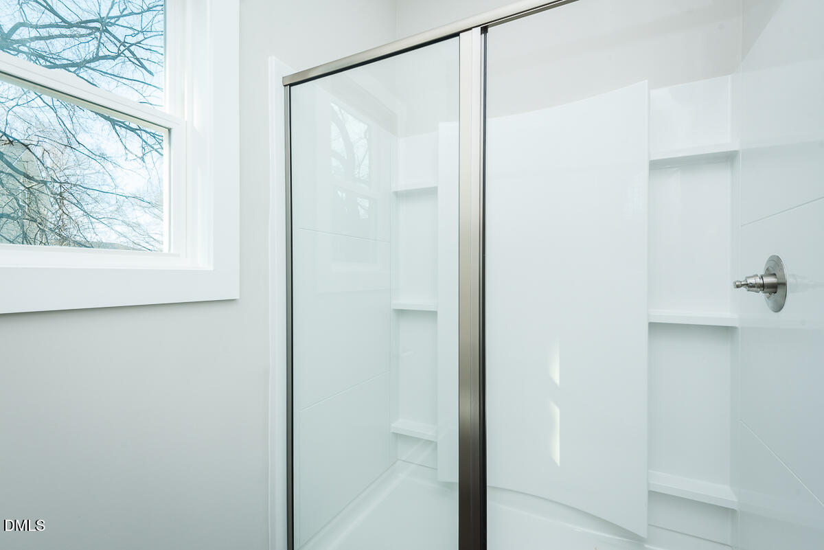 555 Pinnix Road Burlington, NC 27217 - Photo 14 of 21 a bathroom with a glass shower door