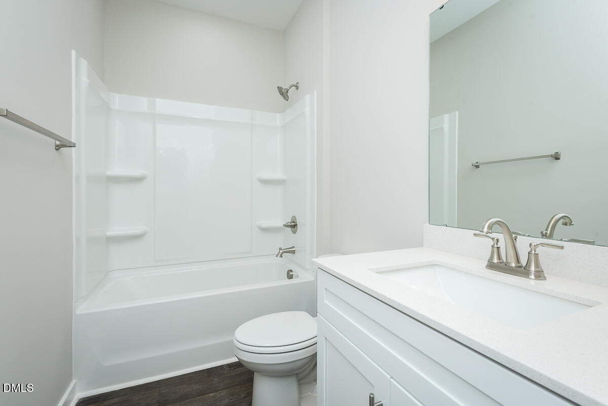 555 Pinnix Road Burlington, NC 27217 - Photo 18 of 21 a bathroom with a sink a toilet and a bathtub