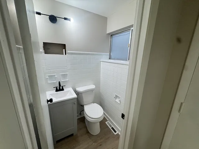 a bathroom with a toilet and a sink