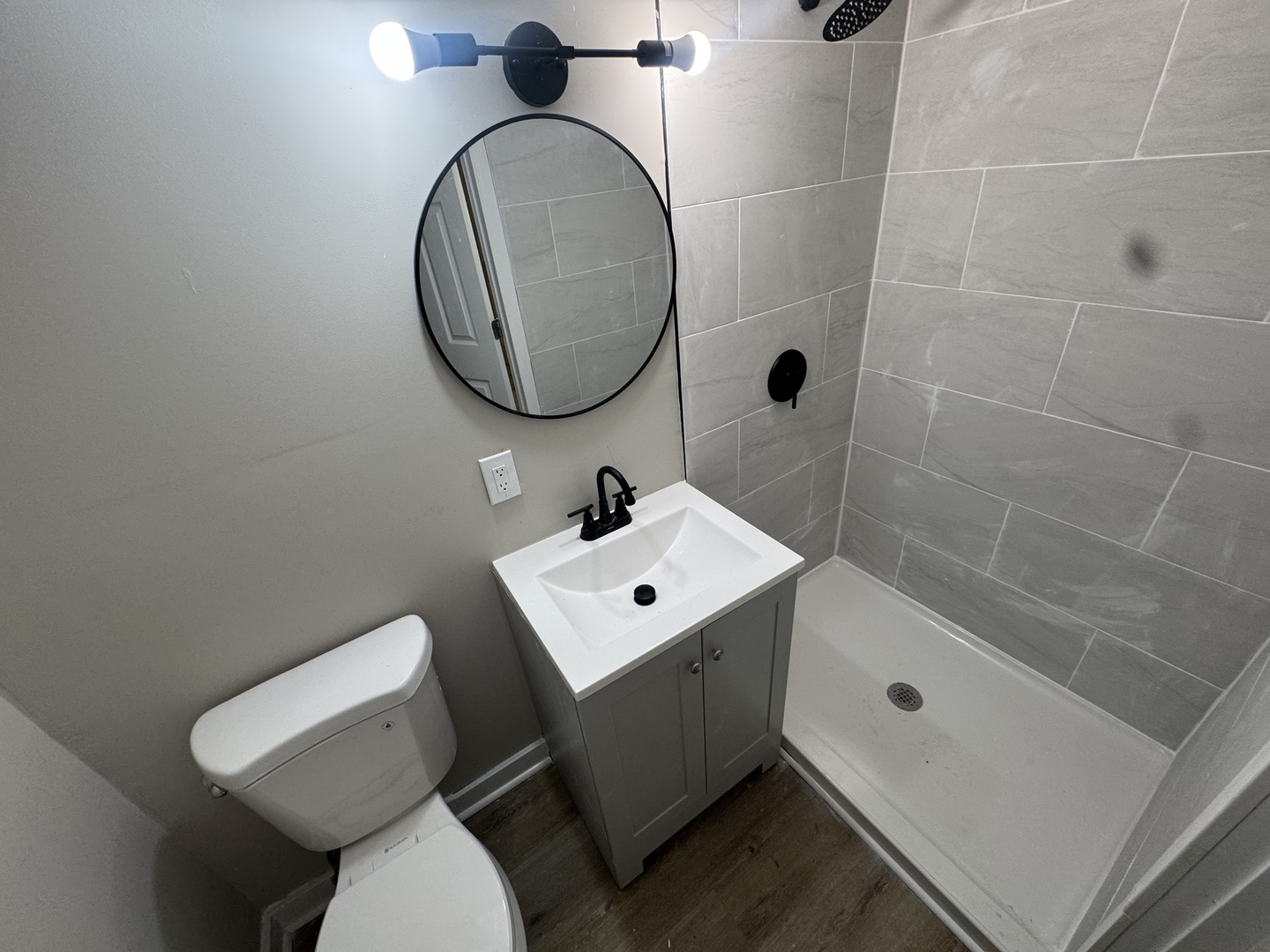 15041 Oak Street Dolton, IL 60419 - Photo 14 of 19 a bathroom with a sink toilet and a mirror