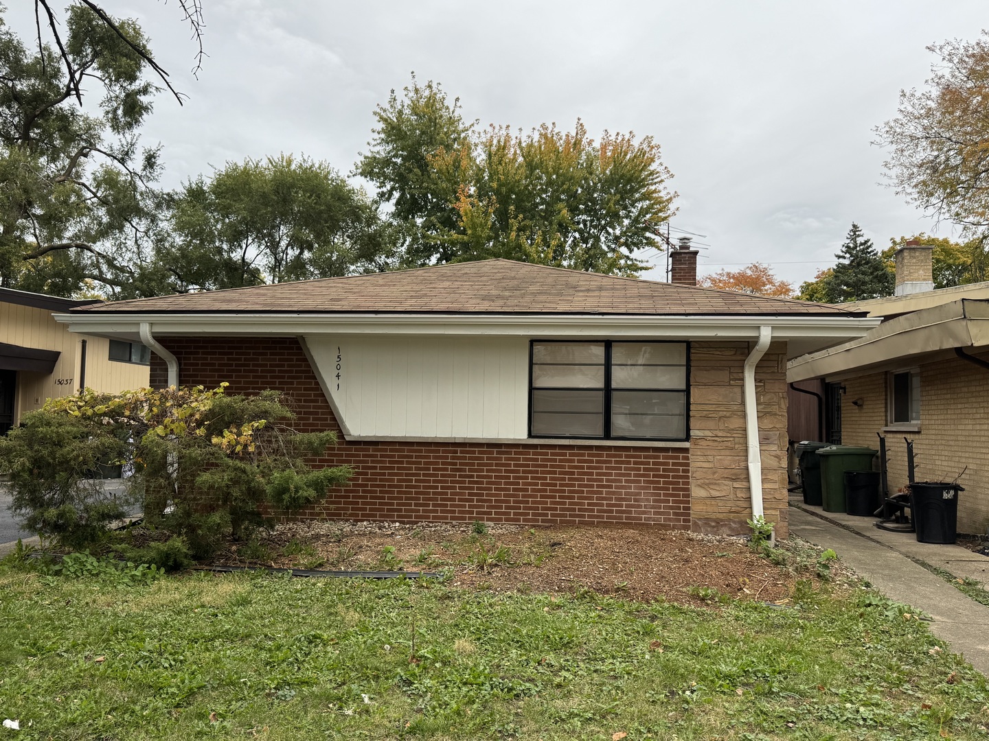 15041 Oak Street Dolton, IL 60419 - Photo 2 of 19 a front view of a house with garden