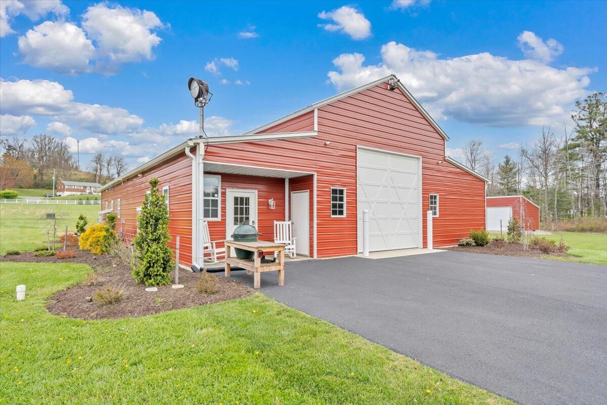 9651 Bent Mountain Road Bent Mountain, VA 24059 - Photo 40 of 71 a front view of a house with a yard and outdoor seating