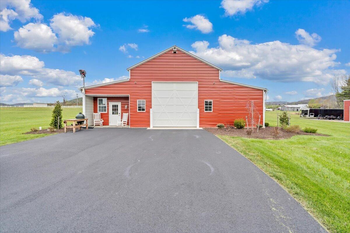 9651 Bent Mountain Road Bent Mountain, VA 24059 - Photo 43 of 71 a front view of a house with a yard and garage