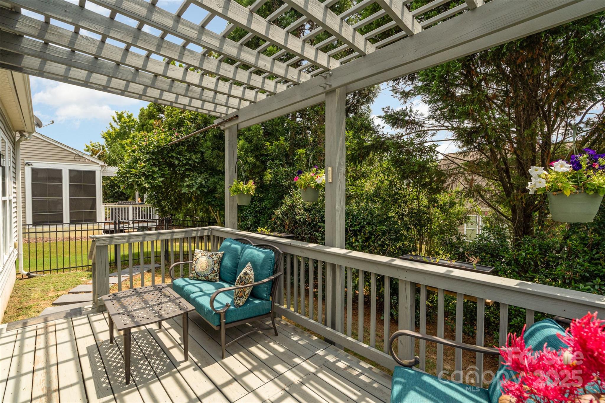 4079 Murray Street Fort Mill, SC 29707 - Photo 18 of 38 a view of a patio with a table chairs and a backyard