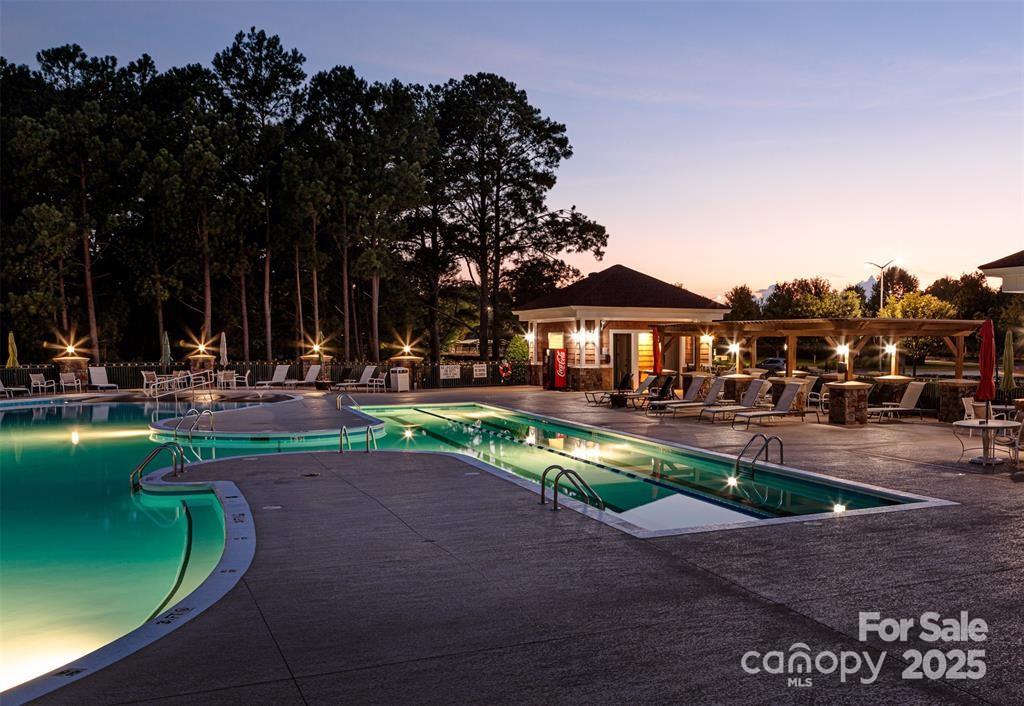 4079 Murray Street Fort Mill, SC 29707 - Photo 26 of 38 a front view of a house with garden and sitting area