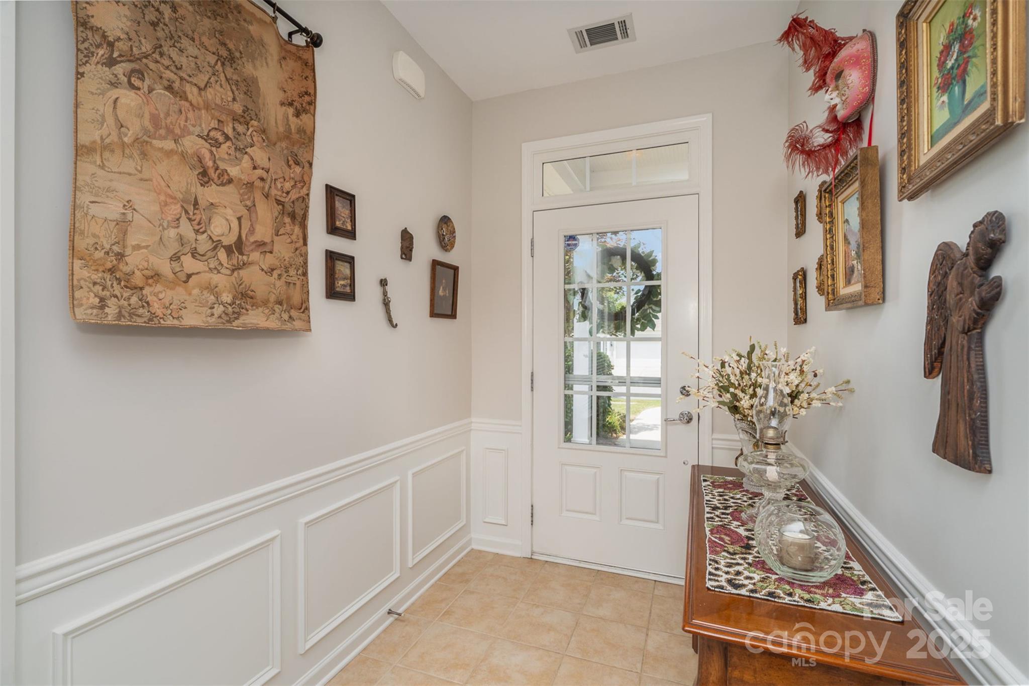 4079 Murray Street Fort Mill, SC 29707 - Photo 4 of 38 a view of an entryway with paintings on the wall