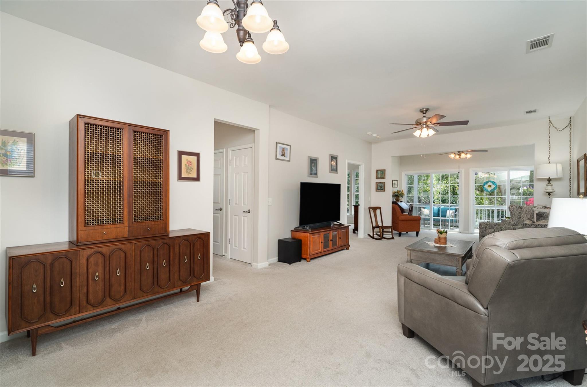 4079 Murray Street Fort Mill, SC 29707 - Photo 6 of 38 a living room with furniture and a flat screen tv