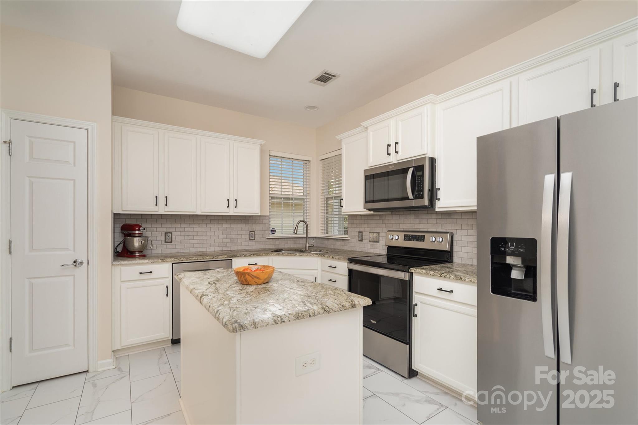 4079 Murray Street Fort Mill, SC 29707 - Photo 9 of 38 a kitchen with a stove a sink and a refrigerator