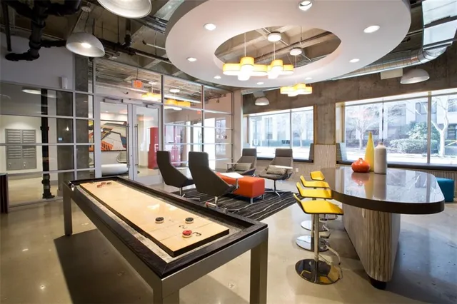 a kitchen with a stove and a table with projector